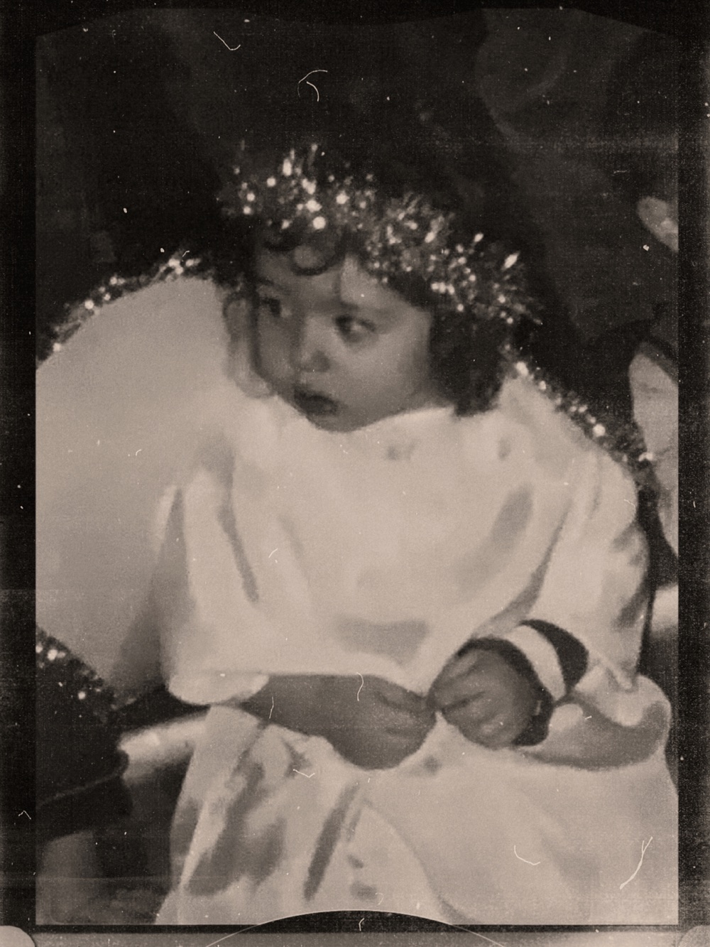 Eleni as a toddler dressed as an angel