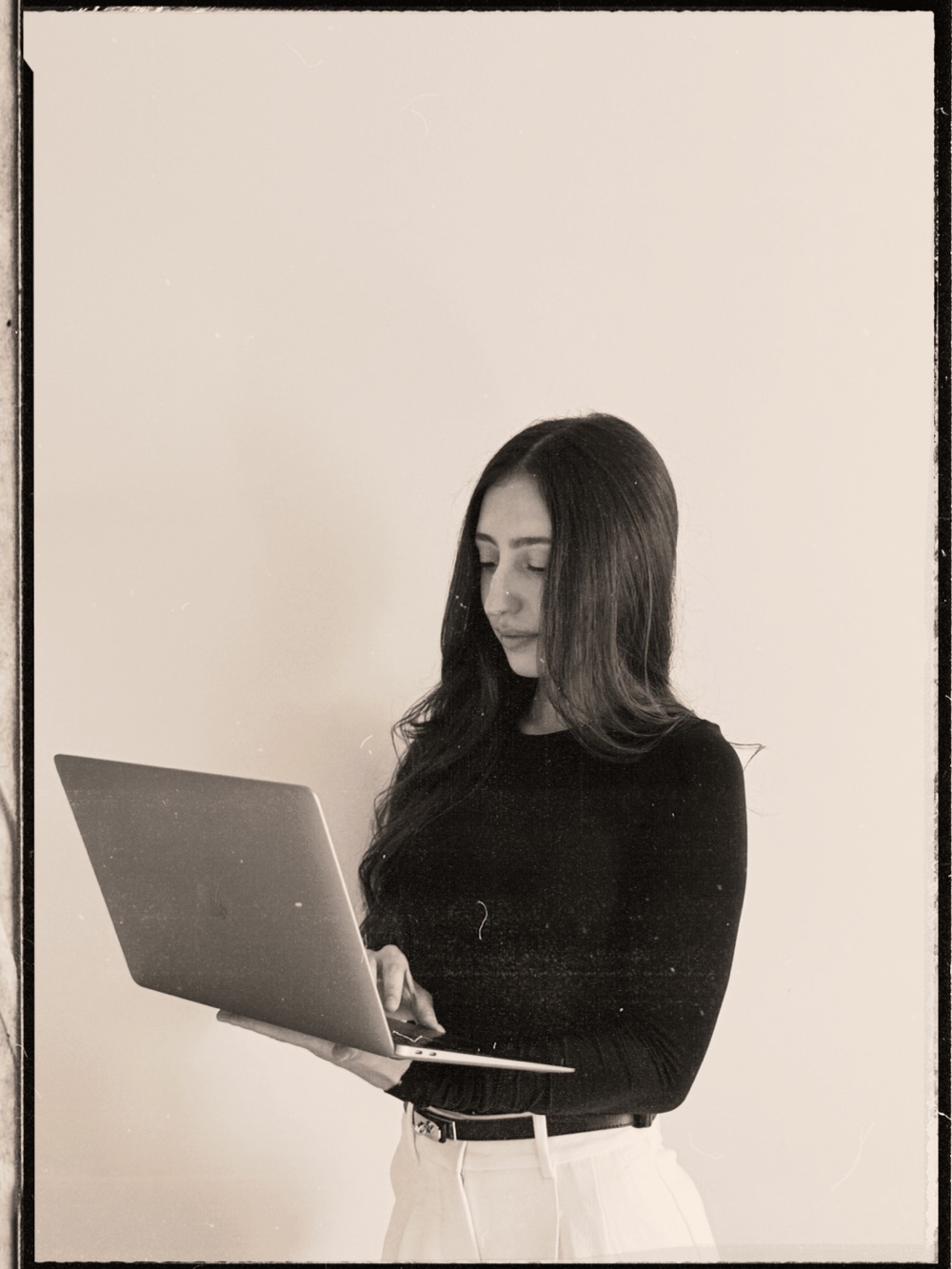 Eleni holding a laptop