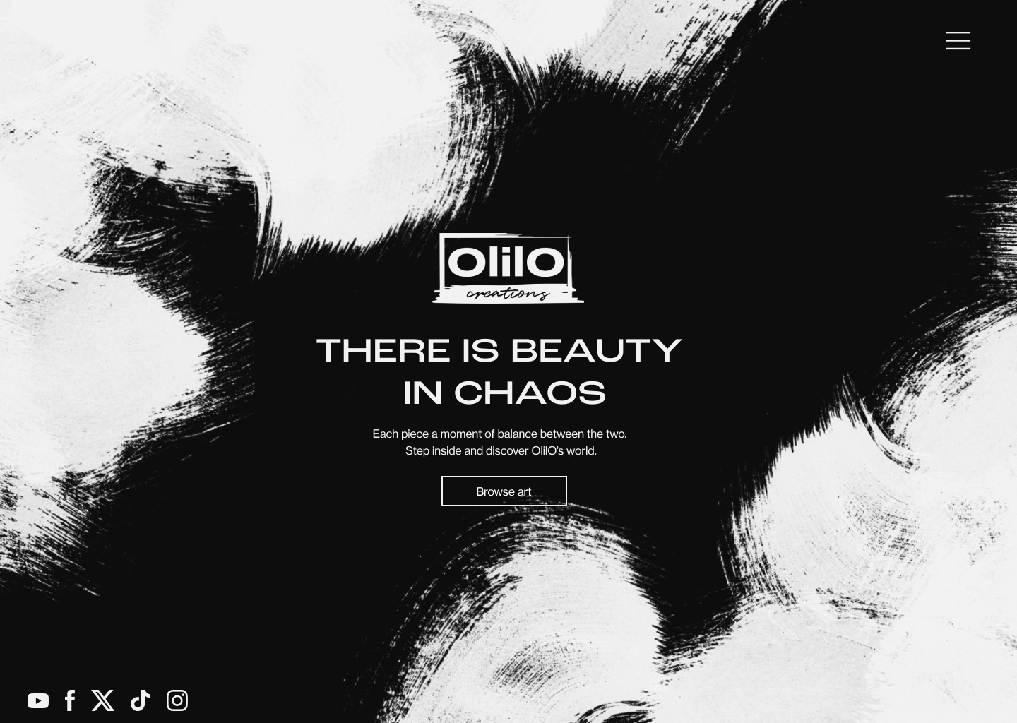 OlilO home page: the logo and the words There is beauty in chaos over black and white brush strokes